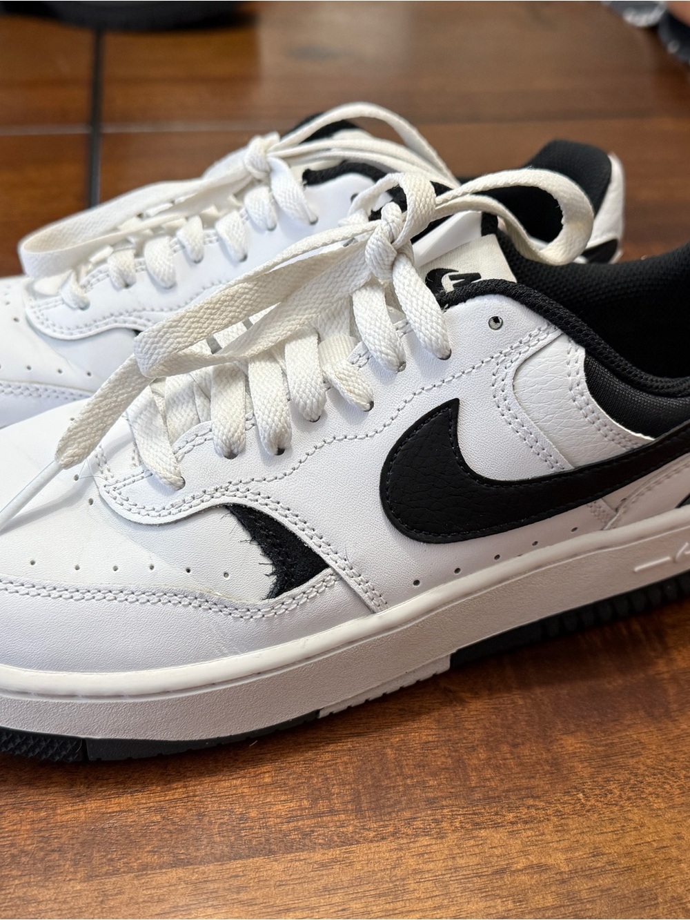 Nike Gamma Force sneakers in classic white and black.
